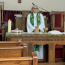 Pastor Jean at the Communion Table