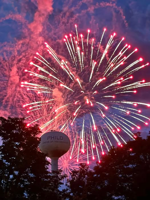 Philo's water tower with fireworks in the background